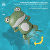 A green wind-up frog toy is shown swimming in water, demonstrating an innovative mechanical structure that costs no electrici
