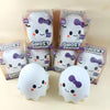 A collection of ghost squishy stress relief toys in clear packaging and loose, white ghost-shaped squishies with purple detai