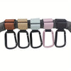 A set of heavy-duty stroller hooks in various colors including brown, beige, mint green, and pink.