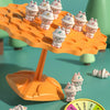 An orange frog balance tree math game with several small frog figures and a yellow spinner.