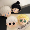 A collection of black and white Jujutsu Kaisen anime plush keychains featuring various characters.