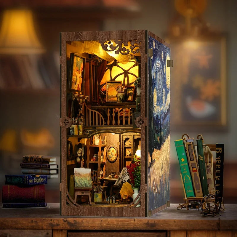 A wooden book nook kit featuring miniature figurines and detailed scenes inside a display box.