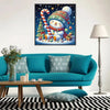 A framed diamond painting featuring a snowman and a Christmas tree against a starry night background.