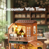 A detailed wooden miniature dollhouse shop with an open facade and interior display.