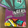 A box of the FLIP! card game showing several cards and a deck box with instructions.
