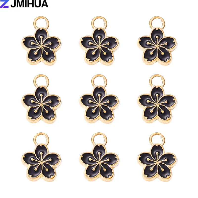 Fifteen enamel flower and cherry charms for jewelry making in gold tone.