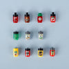 A collection of small building blocks featuring various food items like pizza, cake, and condiment bricks in red, green, and 