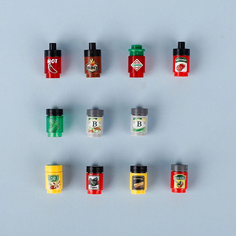 A collection of small building blocks featuring various food items like pizza, cake, and condiment bricks in red, green, and 