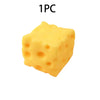 A single yellow cheese squishy fidget toy with a porous texture.