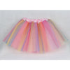 A pink and yellow three-layer tulle tutu skirt for girls displayed flat.