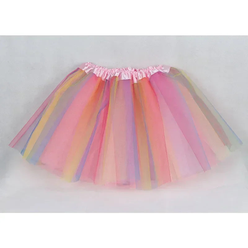 A pink and yellow three-layer tulle tutu skirt for girls displayed flat.