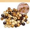 A collection of rustic large-hole wooden beads in various natural wood tones for macrame and jewelry projects.