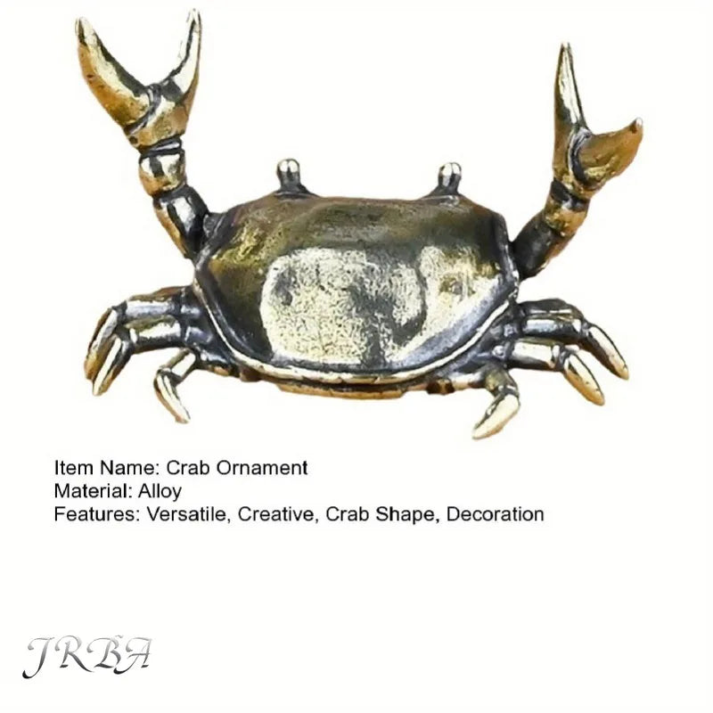 A brass crab ornament figurine with detailed claws and body, used as a desk statue or decoration.