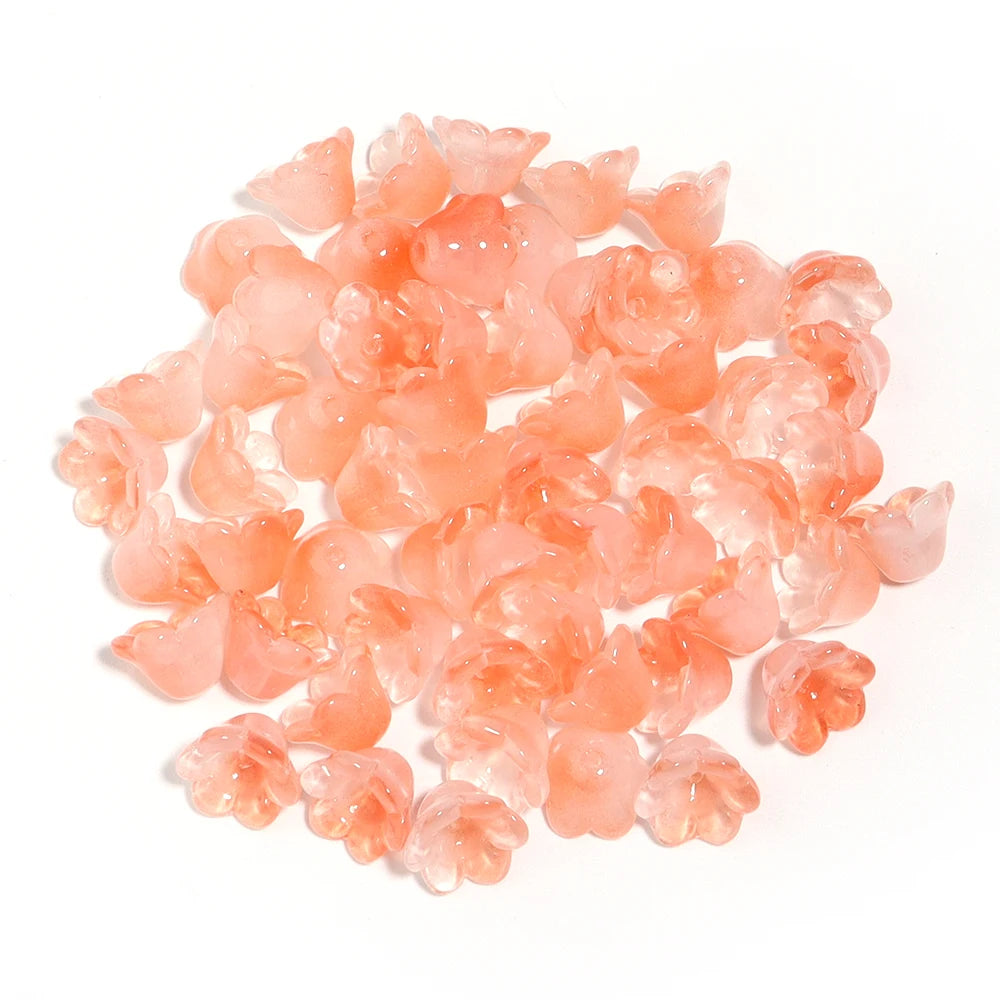 A pile of 50 pieces of pink cherry blossom flower glass beads for jewelry making