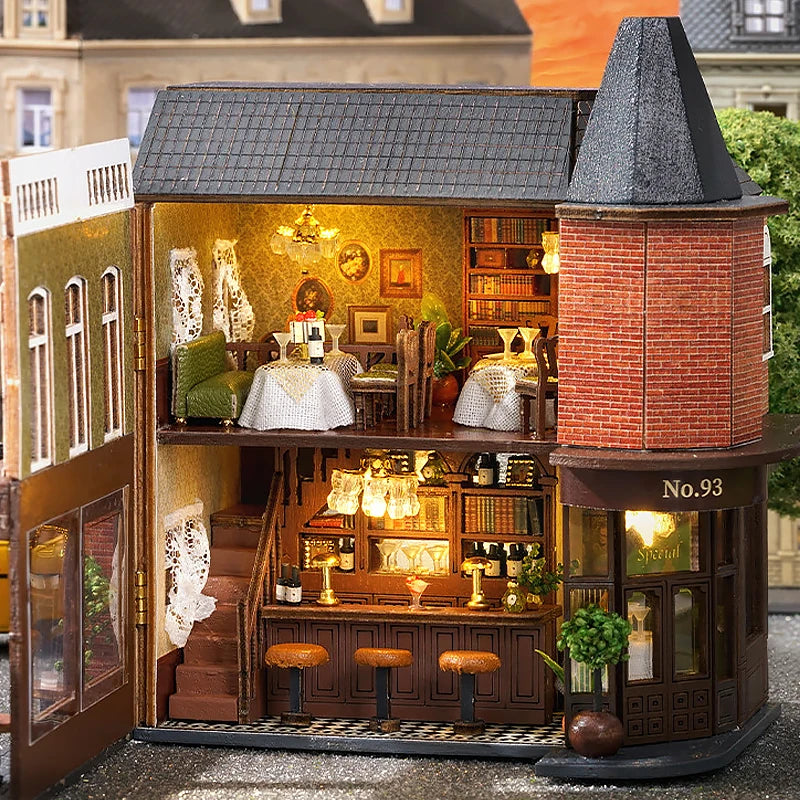 A detailed wooden dollhouse kit of a pink princess villa with interior lighting and features.