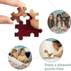 A hand is assembling a jigsaw puzzle featuring a family, friend, and child theme.
