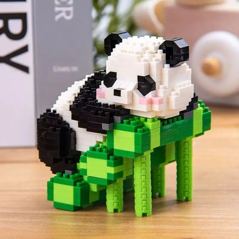 A mini panda building block set featuring white and black blocks in green foliage.