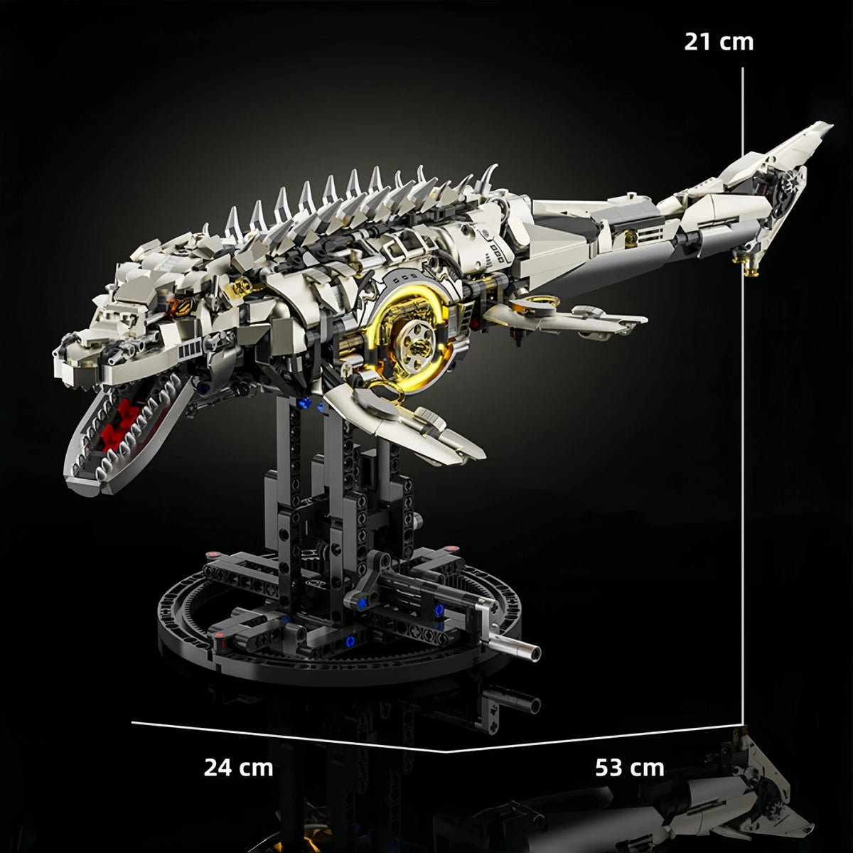 A detailed mechanical model kit of a dragonfly, silver and black, displayed on a stand.