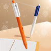 An orange and white squirt water spray ballpoint pen is shown next to a blue and white pen on a light background.