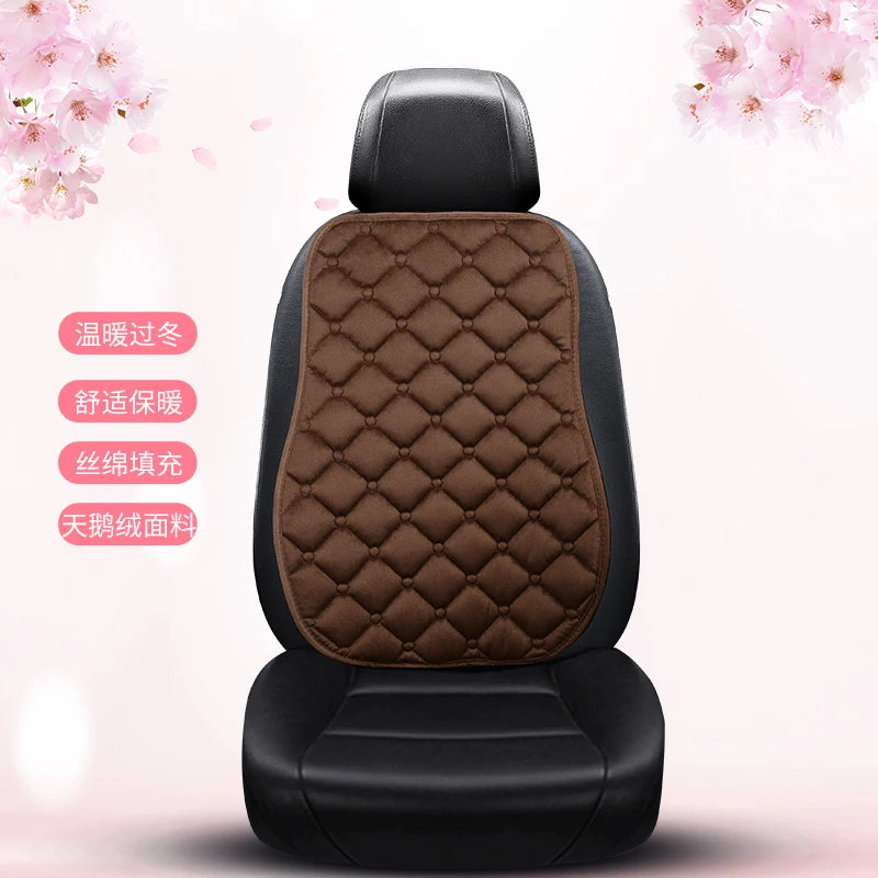 A black car seat cushion with brown quilted leather upholstery and a black headrest, shown against a light pink background.