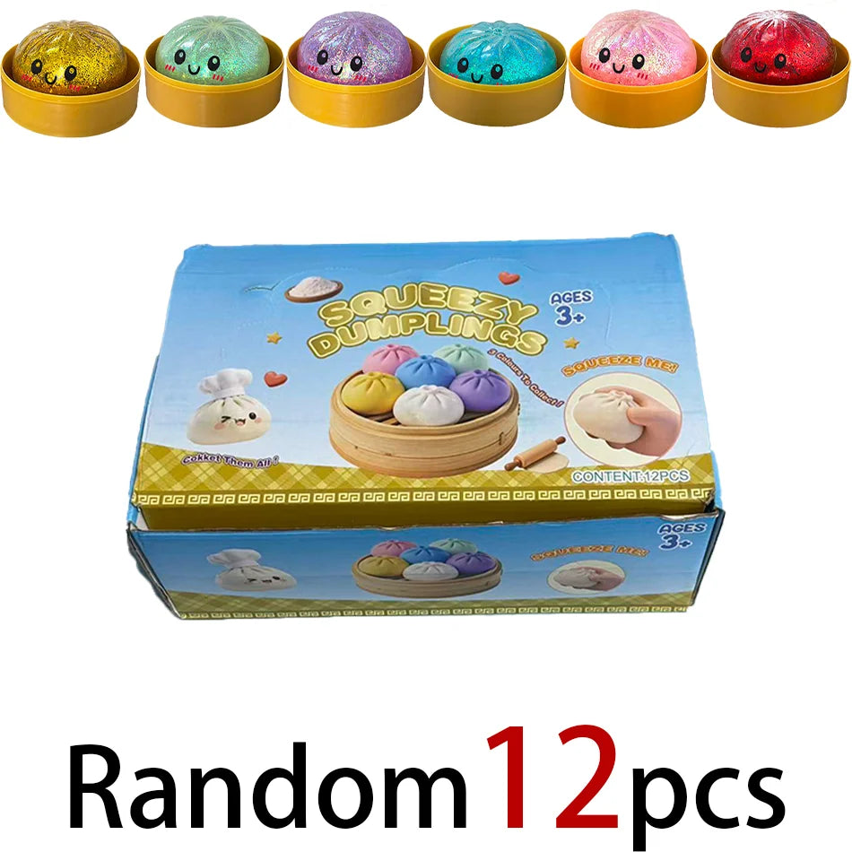 A box of random glitter dumpling squishy stress relief toys in various colors and shapes.