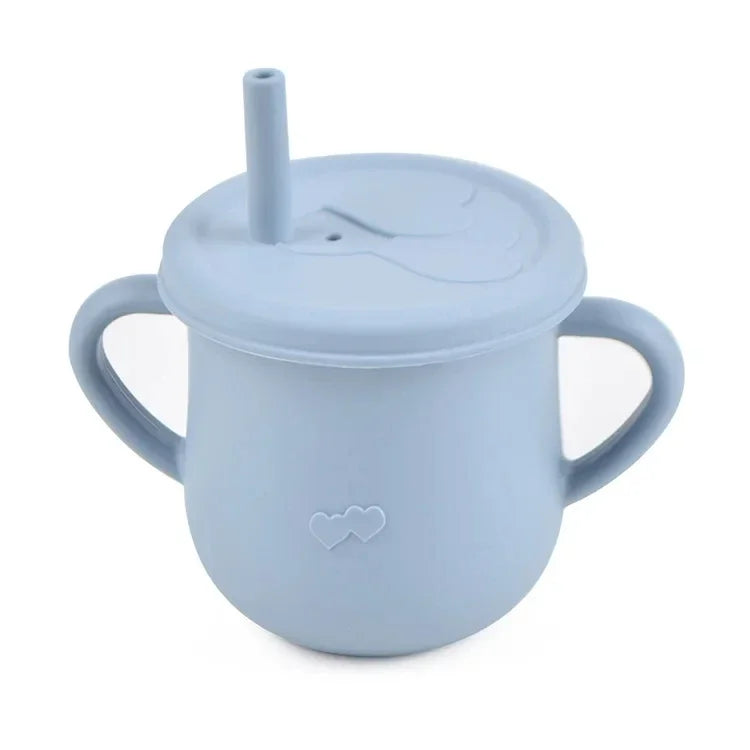 A light blue BPA-free silicone snack cup with a lid and handle for babies and toddlers.