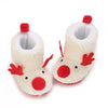 A pair of soft, white baby winter boots with red accents for first walkers.
