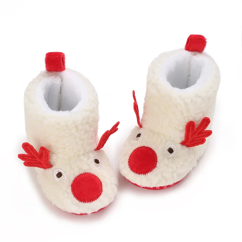 A pair of soft, white baby winter boots with red accents for first walkers.