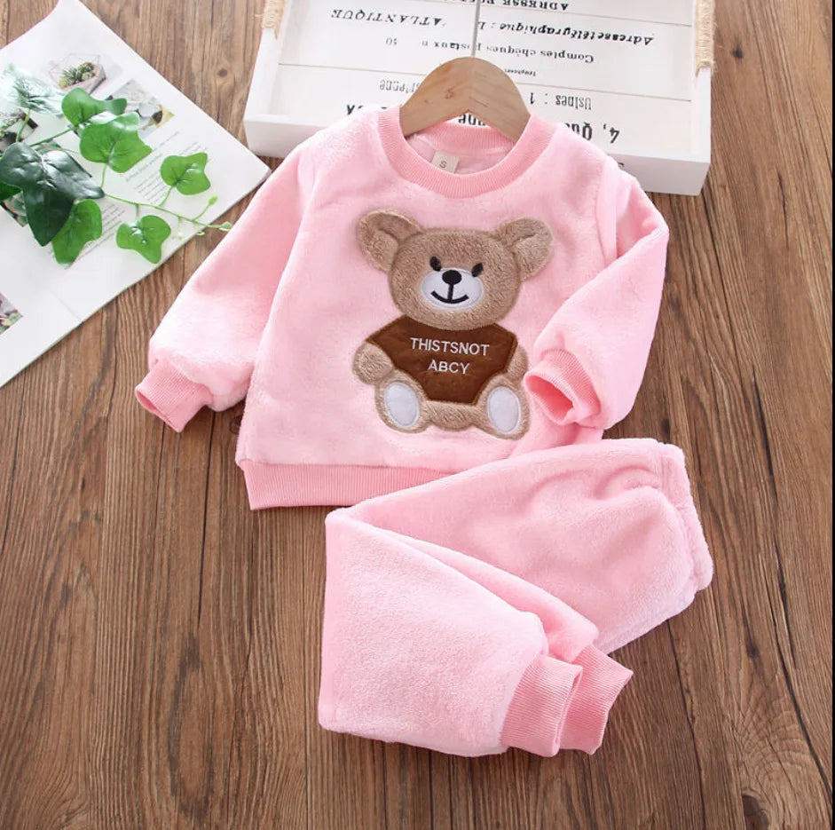 Pink kids winter fleece sweater set with a cartoon bear design for a child