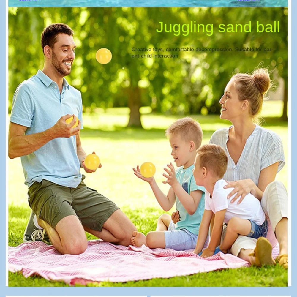 A man and a woman are playing with a juggling sand ball outdoors on a blanket.