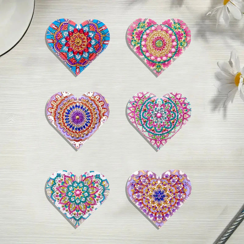 A set of six heart-shaped DIY mandala flower diamond art bookmarks in various shades of pink, blue, and purple on a white bac