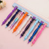 A collection of precision diamond painting pens with various colored tips arranged on a lined notebook page.