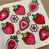 A page from a coloring book featuring various strawberries drawn in bold pink and red outlines with small hearts.