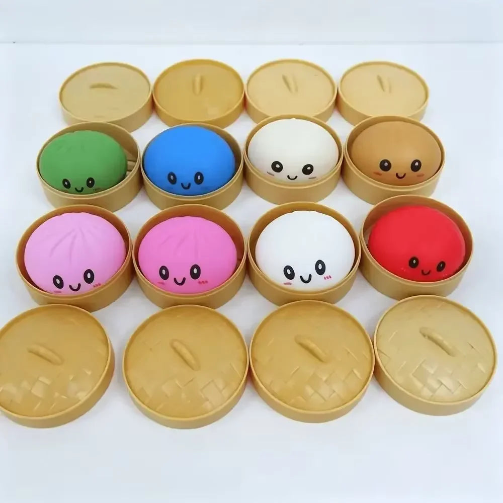 A collection of ten pastel-colored mochi squishy fidget toys in various shades of green, blue, white, and pink, arranged in a