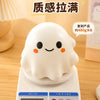 A white squishy stress ball is placed on a digital scale, measuring 480.2 grams.