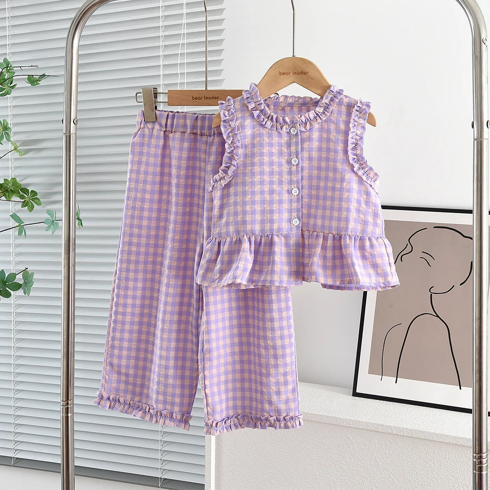 A purple and white checkered lace vest and wide-leg pants set displayed on a hanger.