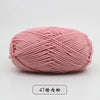 A ball of pink pre-dyed milk cotton yarn used for knitting and crochet.