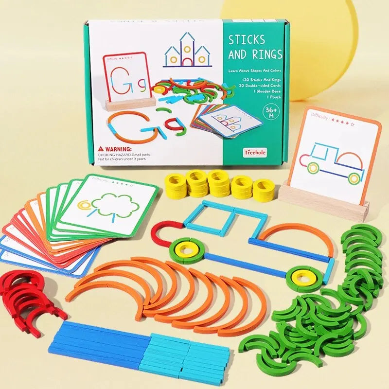 A box of wooden sticks and rings puzzle toys with various colored pieces laid out on a light background.
