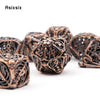 A set of coppery skull metal polyhedral dice for tabletop games, displayed on a white background.