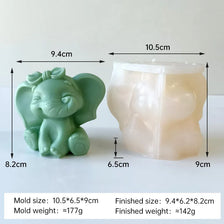 A light green silicone mold of a cartoon elephant used for crafting candles, soap, and resin.