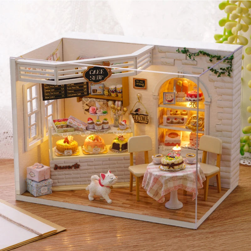 A white miniature dollhouse puzzle kit featuring a cafe interior with furniture and food displays.
