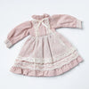 A vintage lace maid dress set for a doll, featuring a pink dress with delicate lace trim and a matching apron.