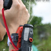 A hand is using a red launcher device to spray water, demonstrating an easy launch distance of about 5 meters.