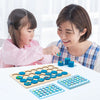 A mother and daughter play a wooden memory chess game with colorful pieces on a white table.