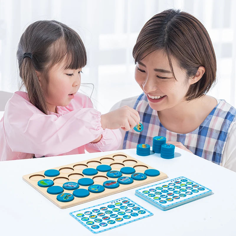 A mother and daughter play a wooden memory chess game with colorful pieces on a white table.