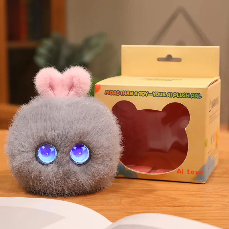 A small, fluffy gray plush rabbit pendant with blue eyes is displayed next to its packaging box.