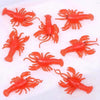 A set of bright orange simulated goldfish bath toys.