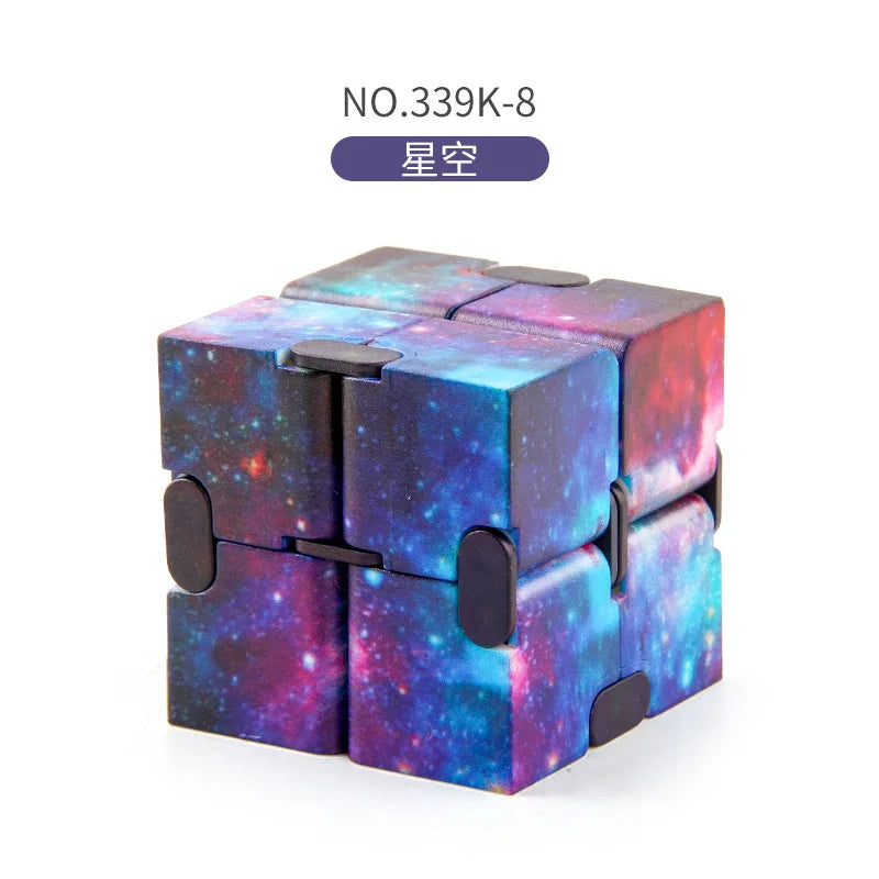 A purple and blue fidget cube with a starry sky design.