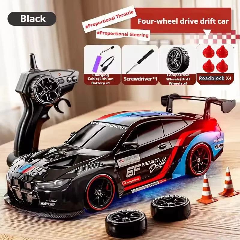 A black four-wheel drive drift car model is shown with accessories and tools on a wooden surface.
