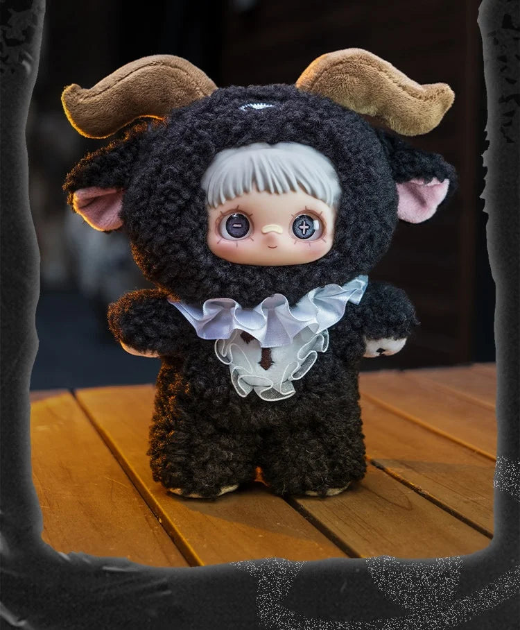 A dark brown, fluffy plush doll with large ears and a white face is displayed on a wooden surface.